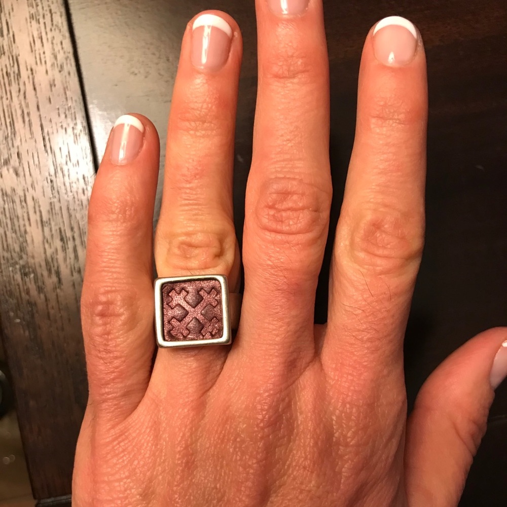 Cool ring with some sort of maroon leathery inset